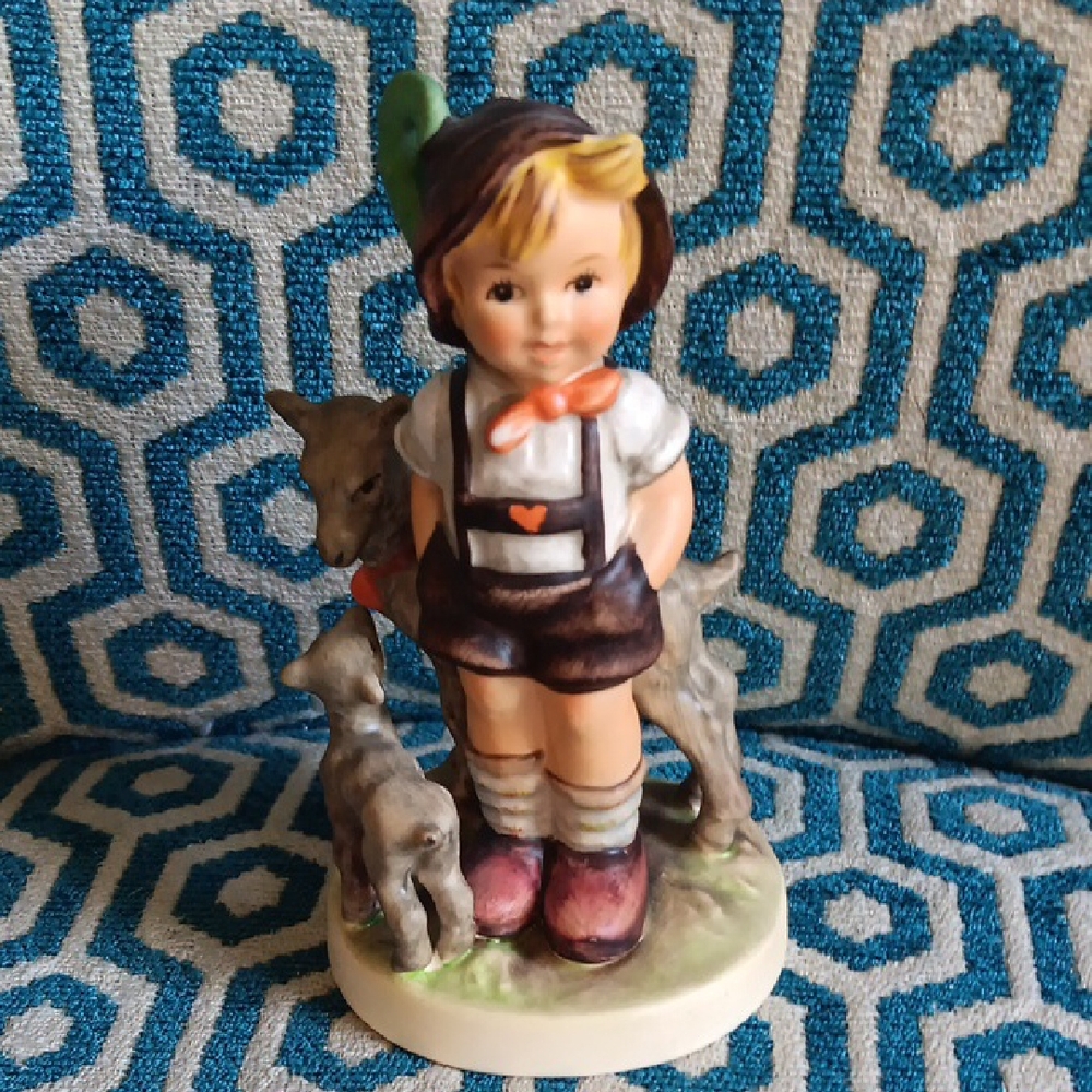 Charming Boy Figurine with Animals